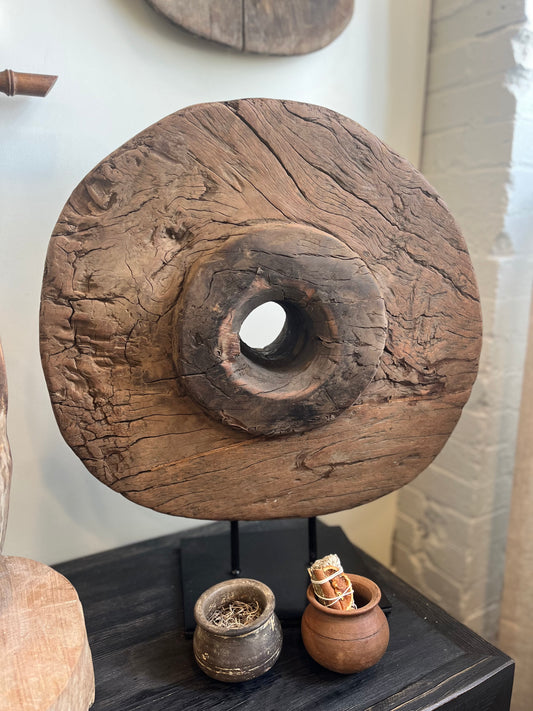 Antique cart wheel on stand