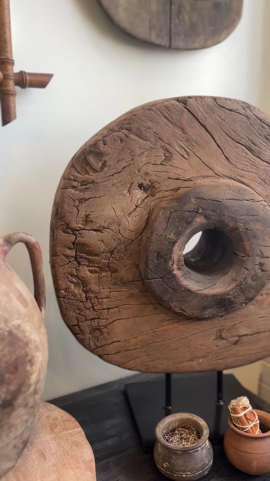 Antique cart wheel on stand